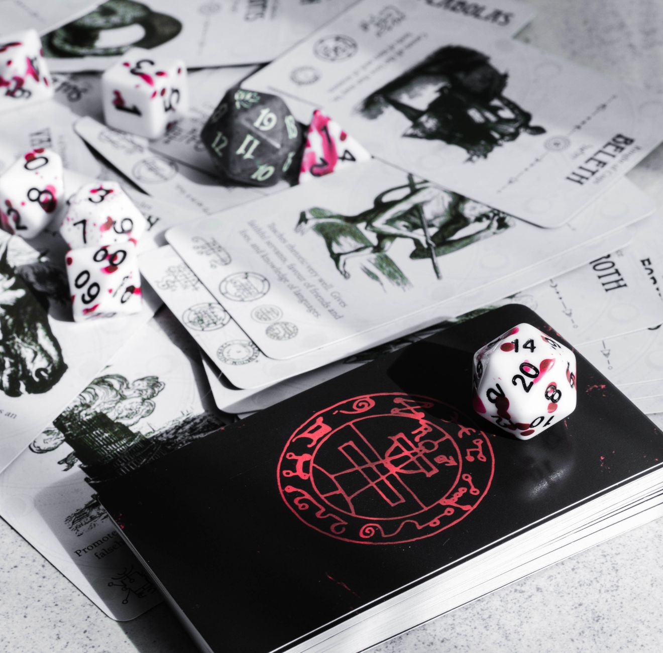 A close-up view of tabletop gaming cards and colorful dice, perfect for game enthusiasts.