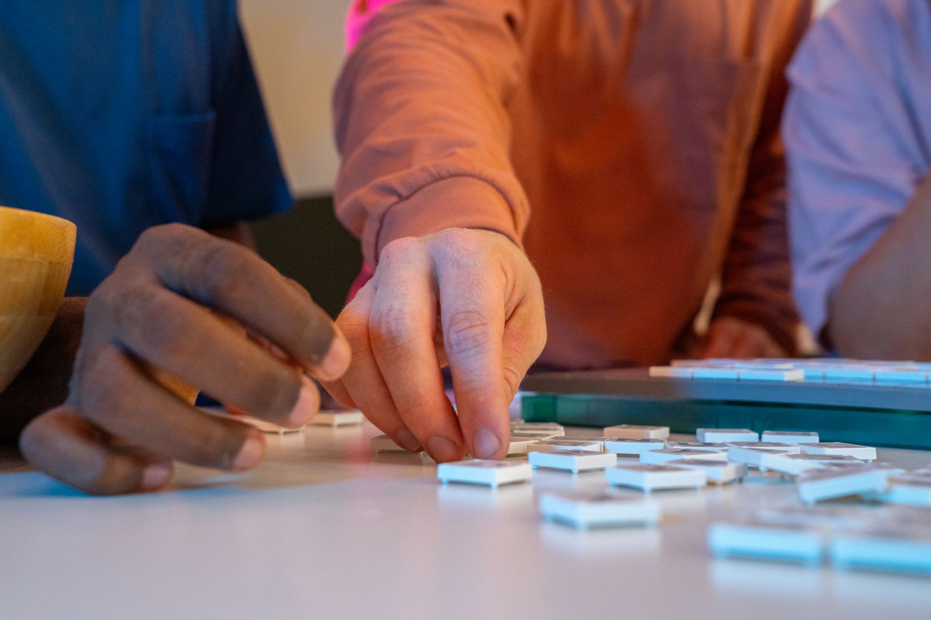 Two friends engaged in a fun board game, emphasizing bonding and interaction.
