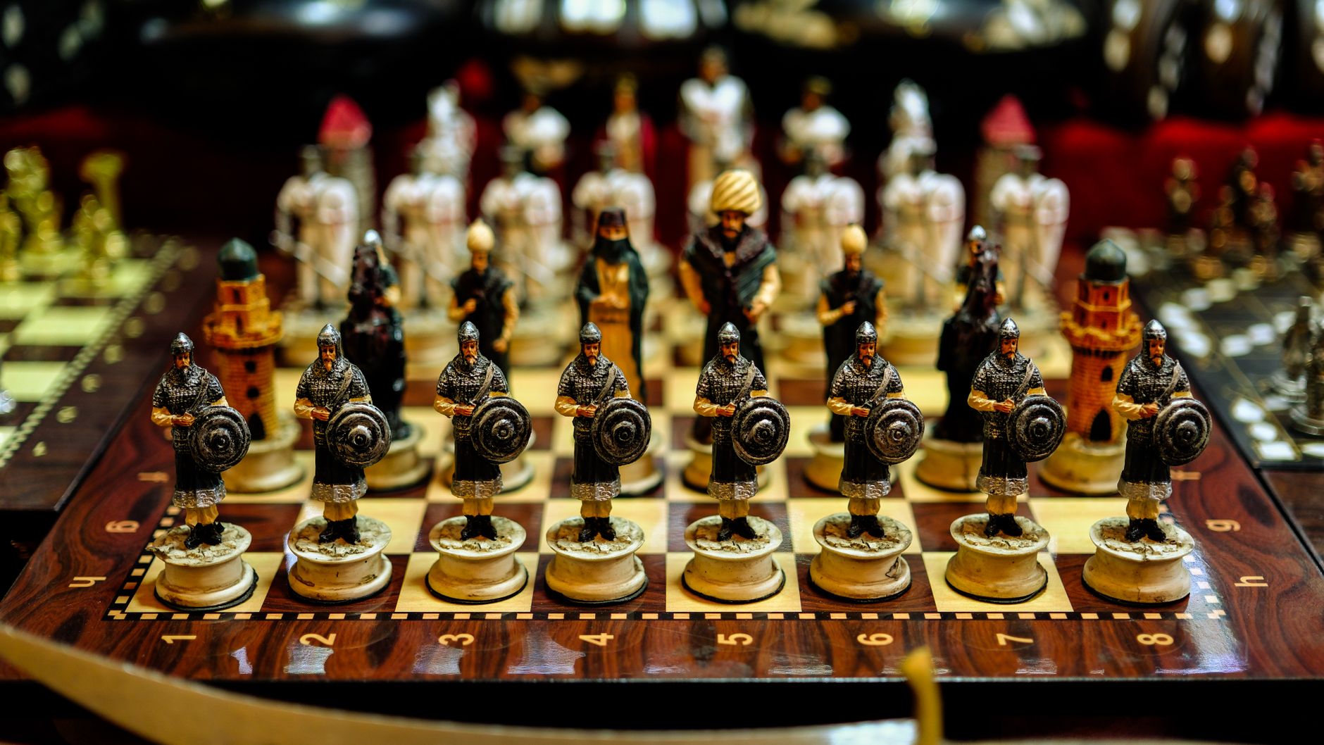 Colorful intricately designed warrior chess set on display in Gaziantep, Türkiye.
